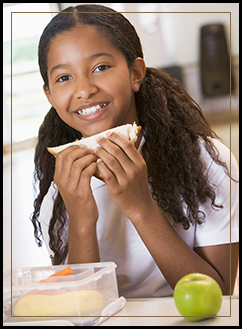 Female student eating a sandwich