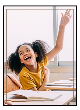 Smiling female student raising her hand