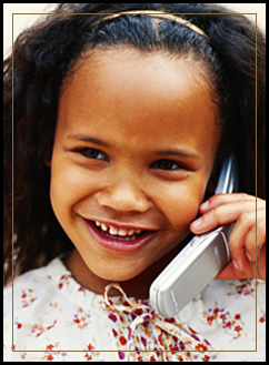 Smiling female student using a cell phone