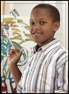 Male student painting with a paintbrush