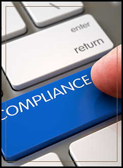 Finger pressing a computer key that says compliance